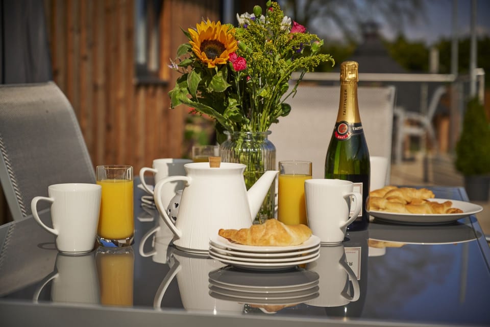 Enjoy alfresco dinning outside with large tables and gas BBQs