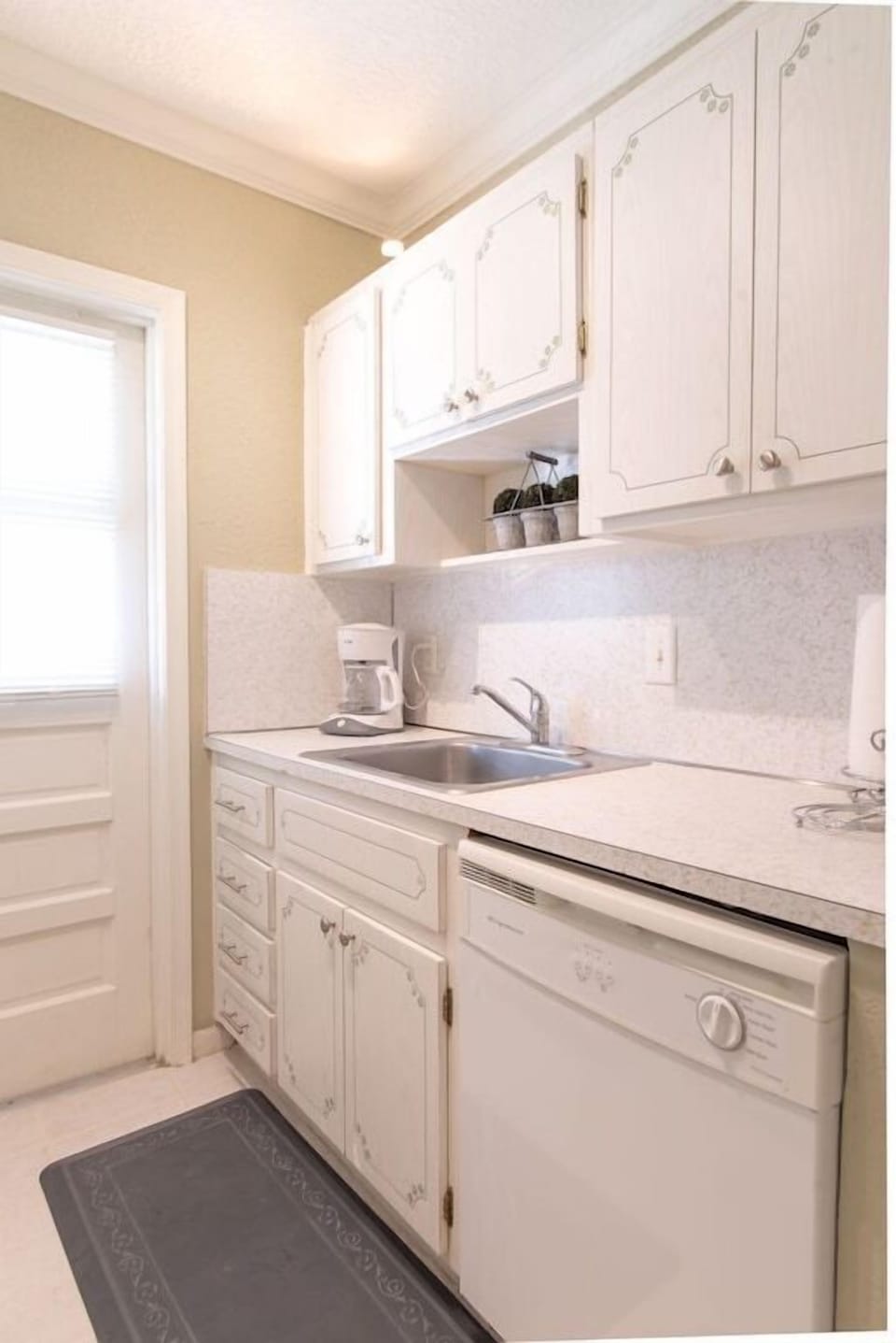 Kitchen cabinets are fully stocked with everything needed to cook and serve a fabulous meal.