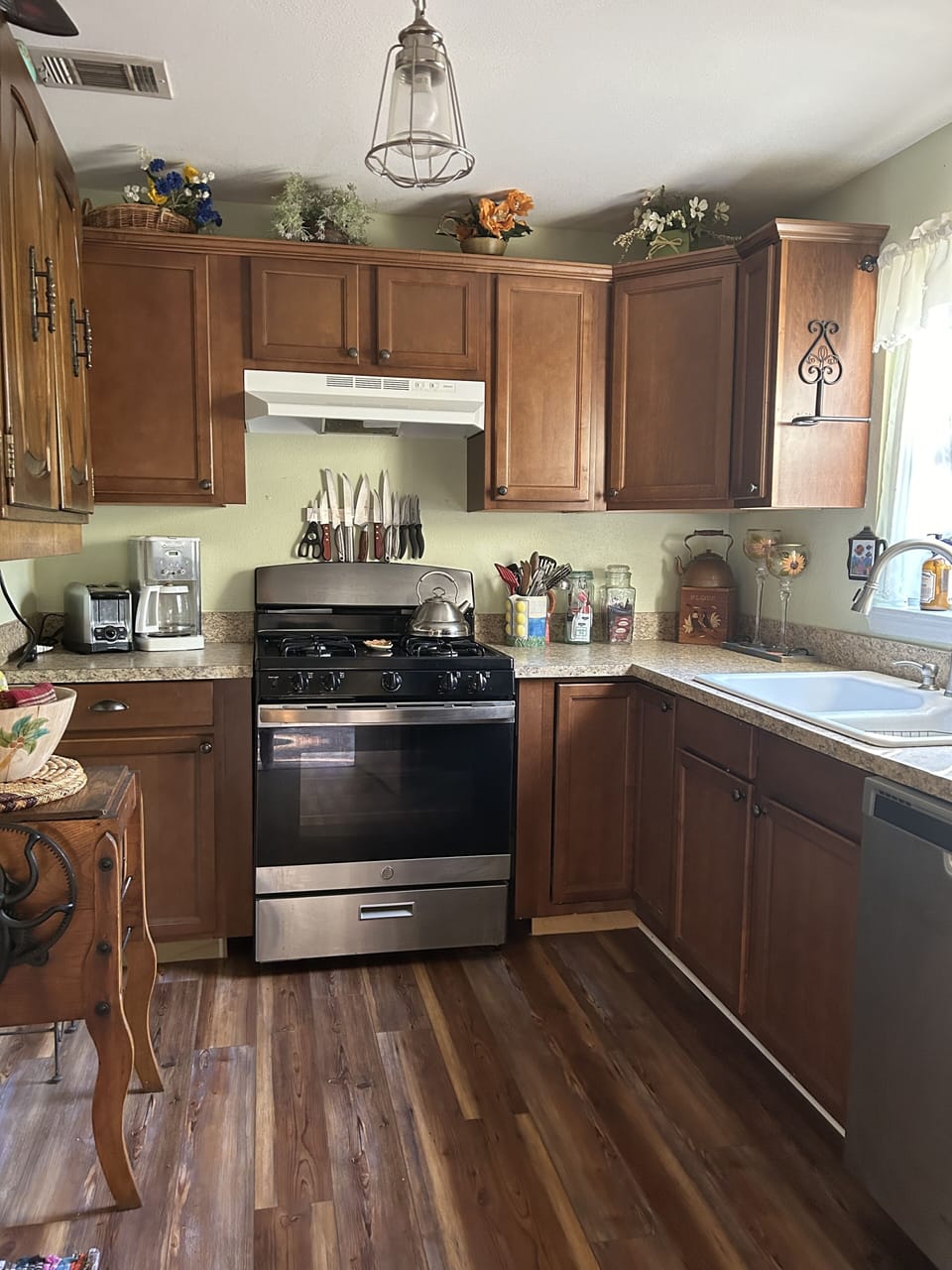 Gas stove for fresh fish cooking. Cast iron skillet ready to fry fresh fish 