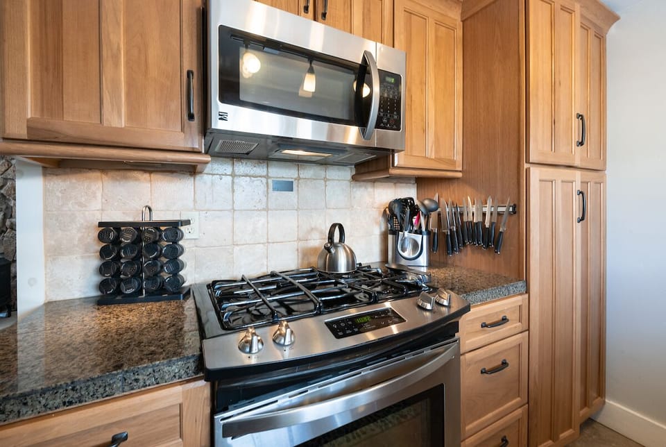 Stainless steel appliances and a gas range make this an excellent kitchen for the chef in the group.