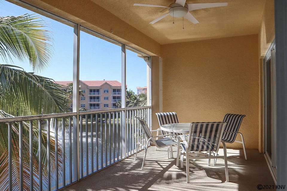 Overlooking the lake and tropical landscaping, the lanai offers a place for hours of relaxation