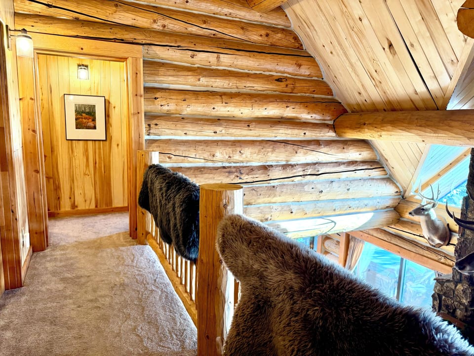 Top floor with bunk room on the right and bathroom on the left.