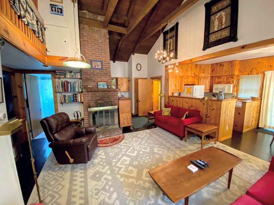 View of the living room, kitchen, and bathroom