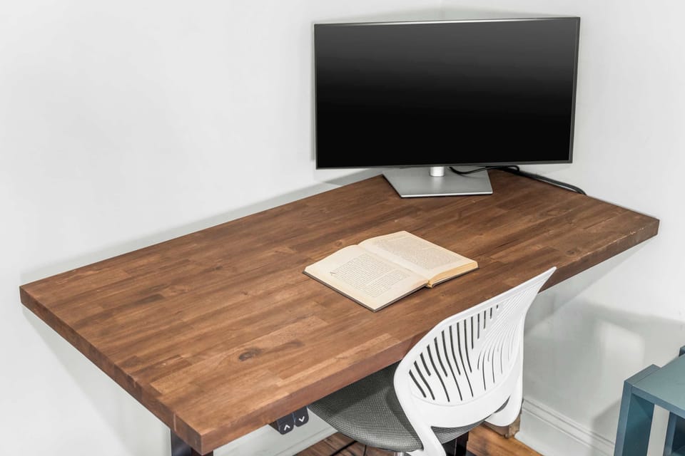 a modern wall-mounted solid wood desk