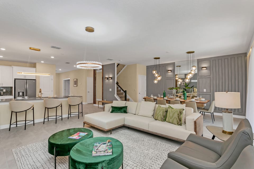 Our Living Room Beckons with Plush Seating, Inviting You to Unwind in Style. With Soft Textures and Warm Accents, It's the Perfect Space to Relax and Reconnect.