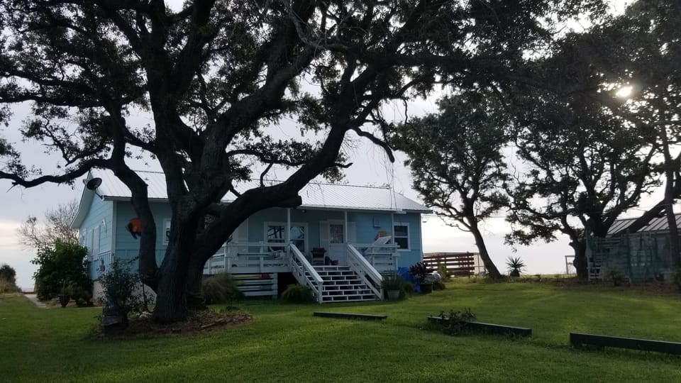 View of The Fun Flamingo Bungalow from the front, lots of room for lawn games