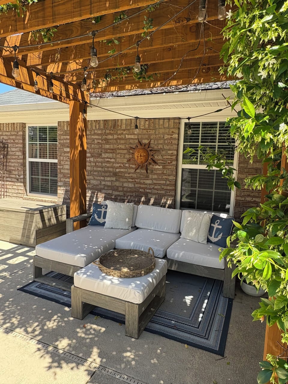 Pergola covered with Confederate Jasmine and garden lights.