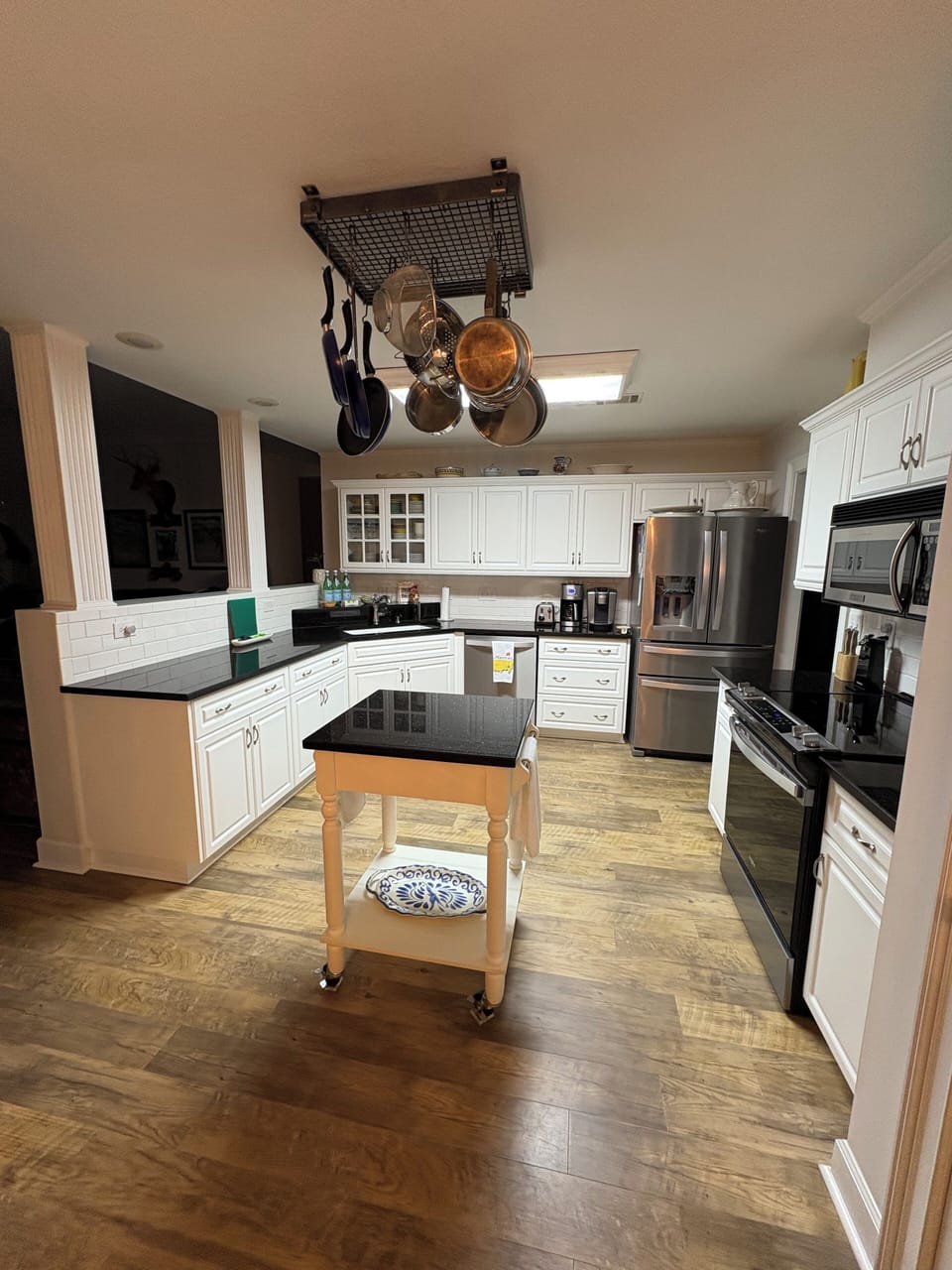 Kitchen with open counter space and updated appliances.
