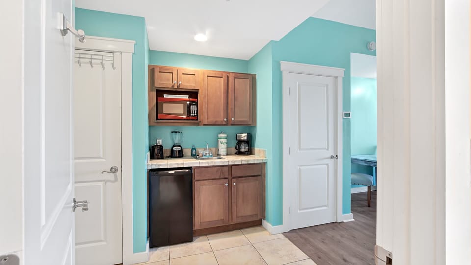 Small breakfast area with mini-fridge, Coffee pot and Microwave. Note. this is not a unit with a kitchen for cooking.