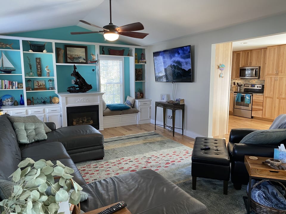 65” screen Smart TV to gather for movie night.