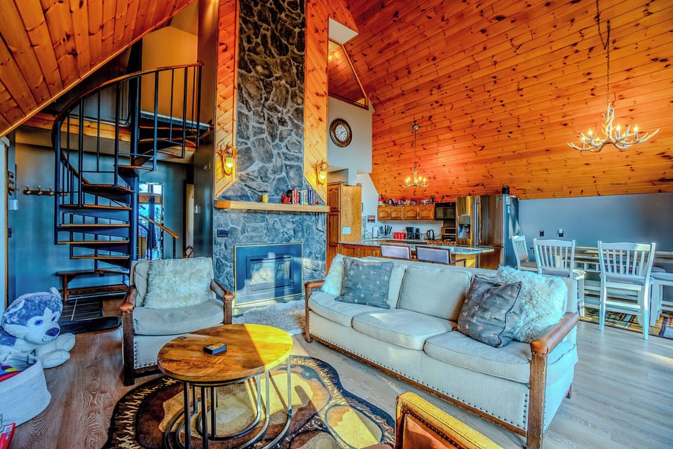 Enjoy the living room with a gas fireplace and tall ceilings.