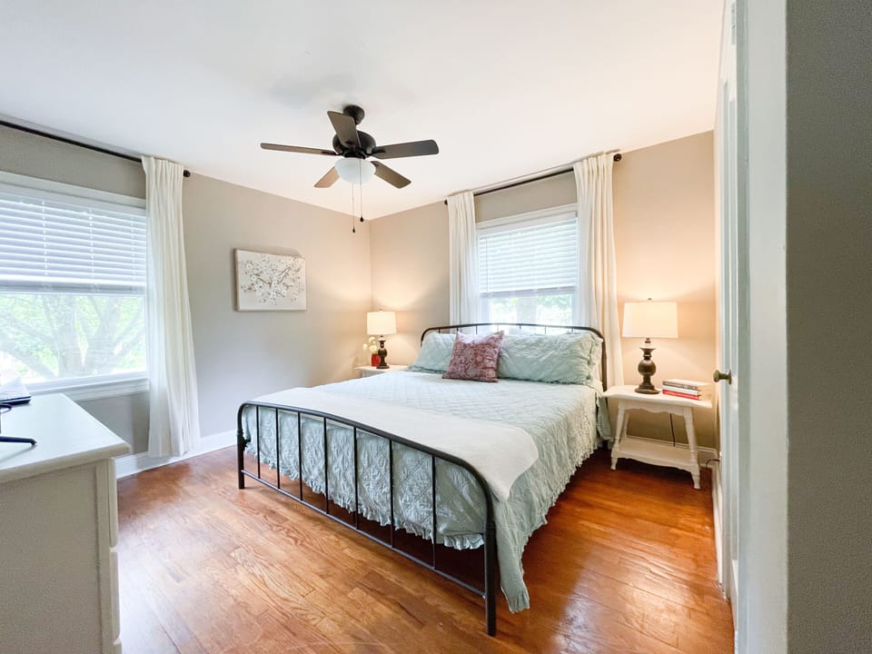 Bedroom 1 has a King Bed, dresser, night stands, lamps. Mattress is memory foam 