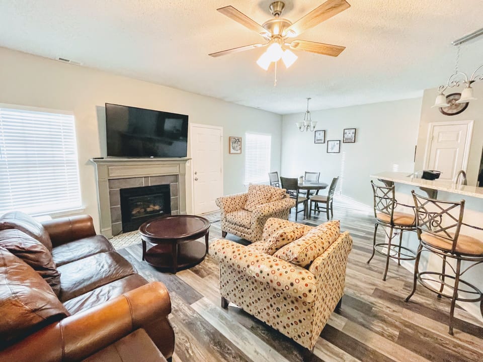 Living room opens to the dining area and the kitchen