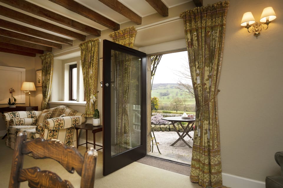 Door leading directly from the sitting room to terrace area and private garden 