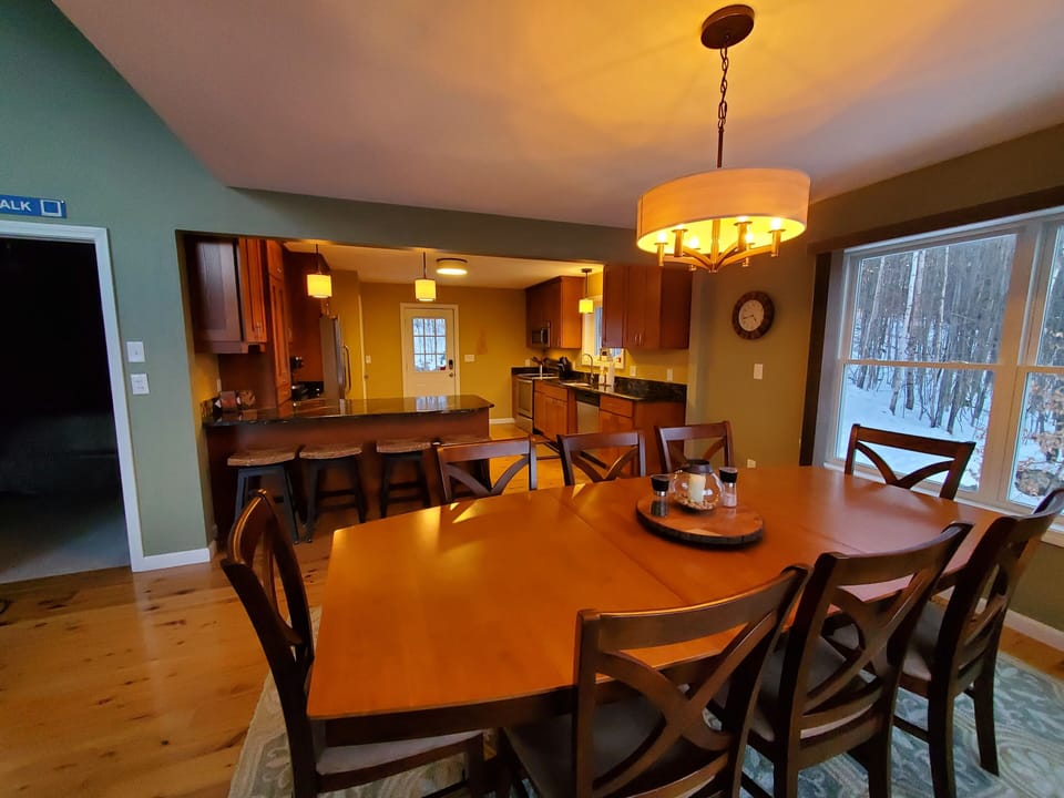 Dining table for 10, plus 4 breakfast bar stools.