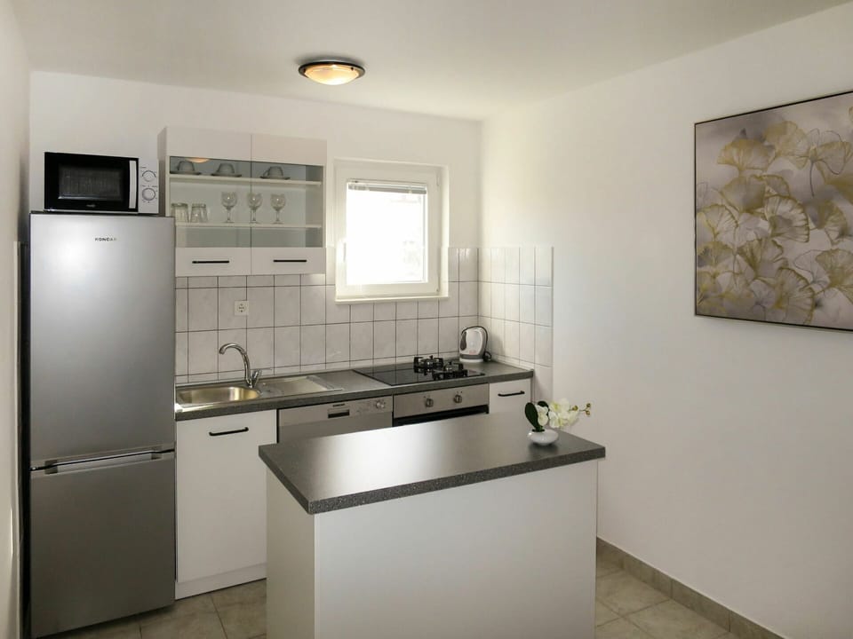 Cabinetry, Sink, Property, Countertop, Kitchen Sink, Tap, Kitchen Stove, Kitchen Appliance, Interior Design, Floor