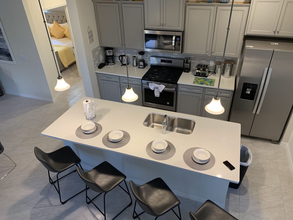 Kitchen island watch while the chef is at work.