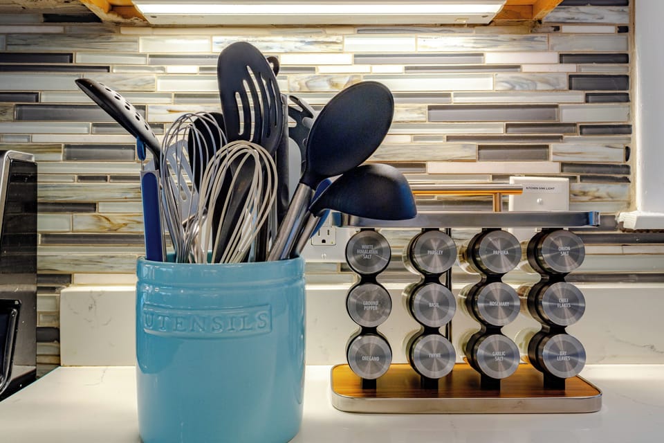 Abundance of cooking utensils and spices available at the property.