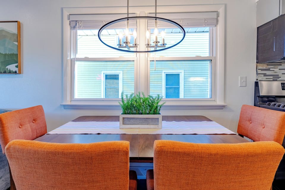Full kitchen and dining table with additional leaf and  4 chairs and a bench. (table can be pulled out from the wall to use the bench for additional seating.