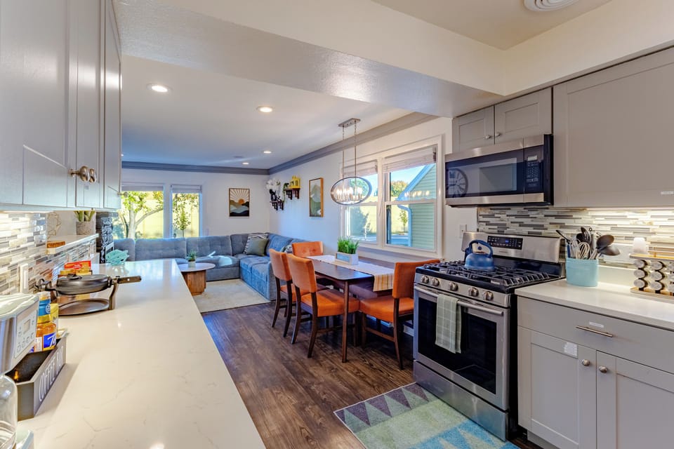 Full kitchen and dining table with additional leaf and  4 chairs and a bench. (table can be pulled out from the wall to use the bench for additional seating.