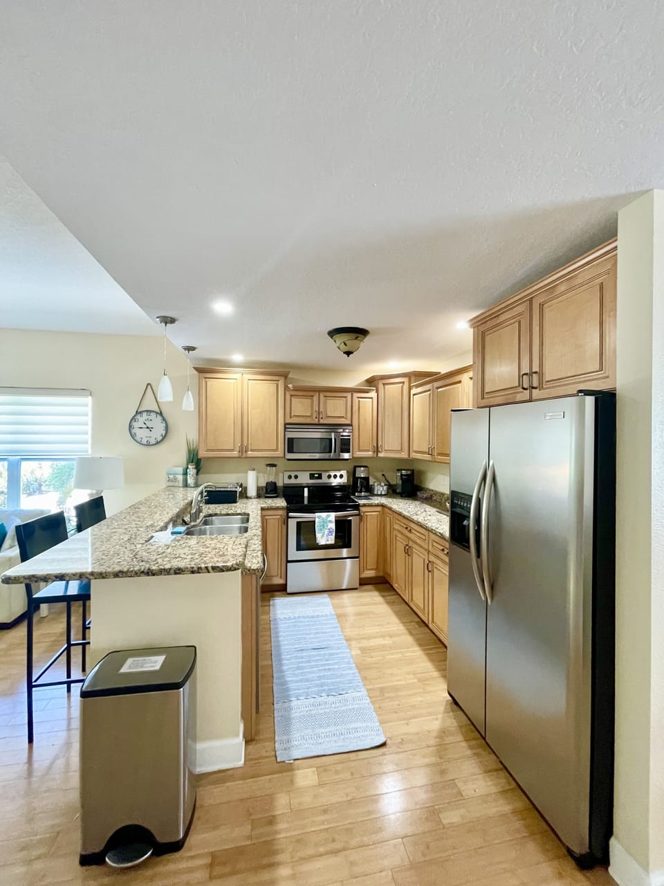 Fully equipped kitchen with toaster oven, blender, Keurig and drip coffee maker.