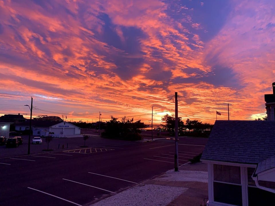 View of sunset down street