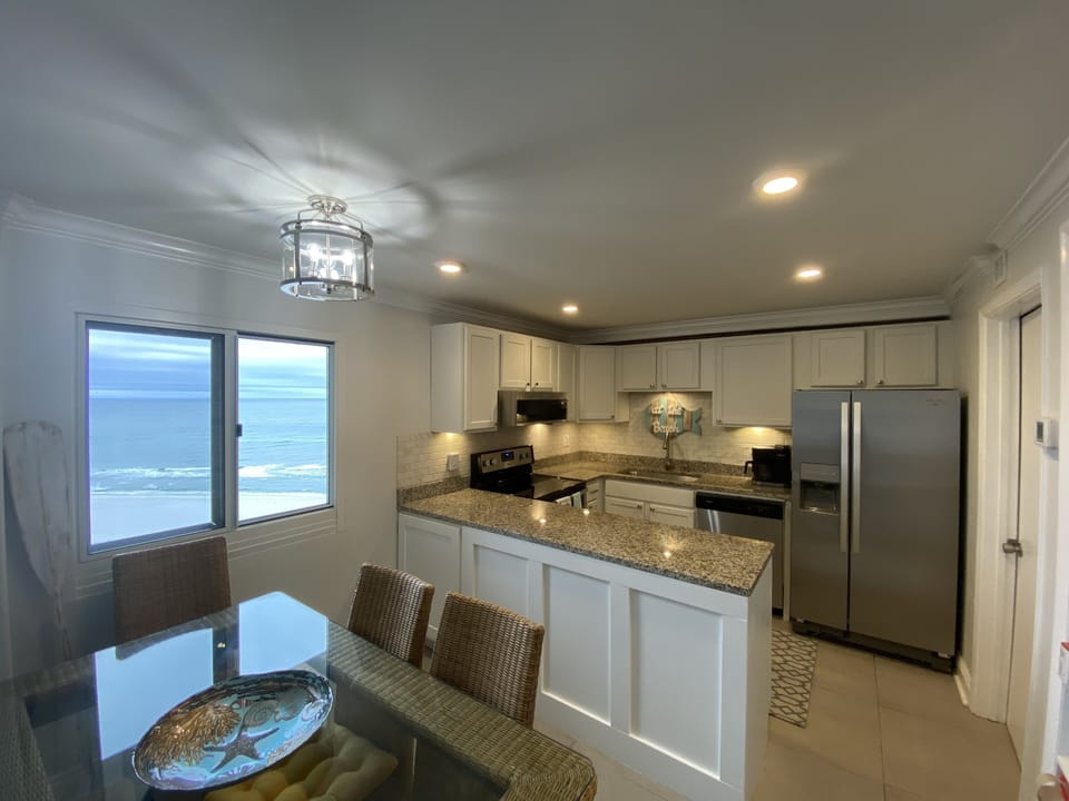 Enjoy meals with a beach view and seating for 6.