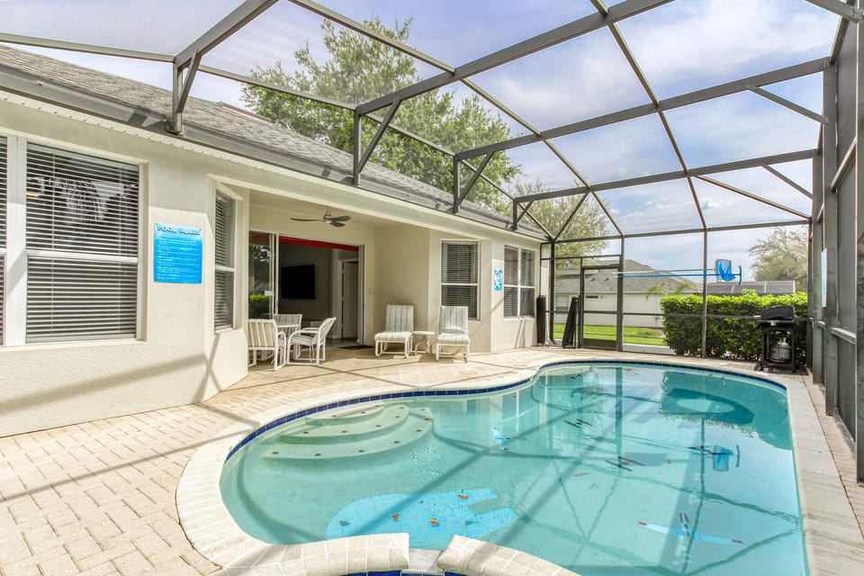 The covered lanai stays shaded all day long and features a ceiling fan.