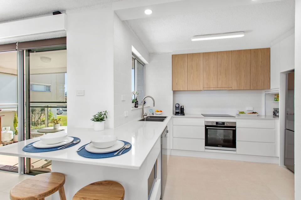 Watch the waves on the beach while enjoying coffee & brekky at the breakfast bar