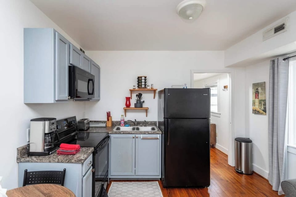 Full size kitchen with refrigerator, stove/oven and microwave