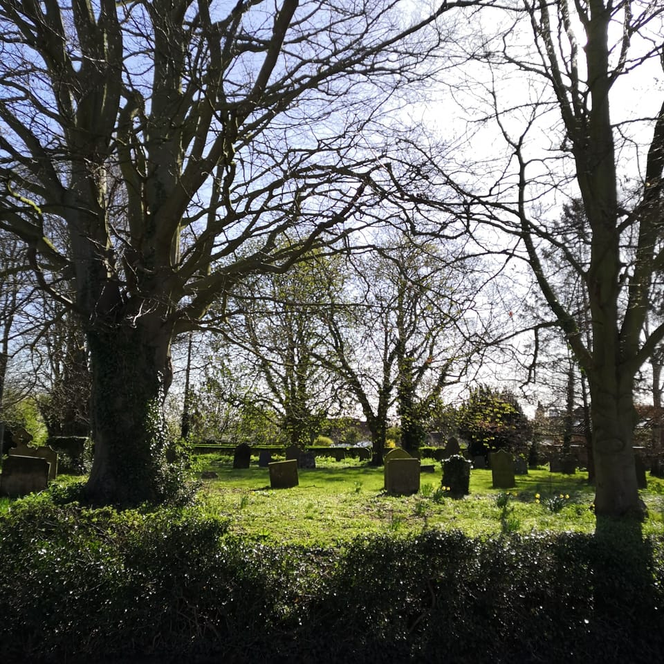 All Saints churchyard with footpath to the village