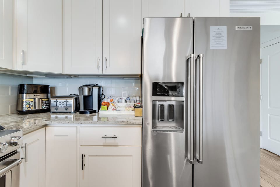 The kitchen has modern conveniences  makes traveling from home simple 