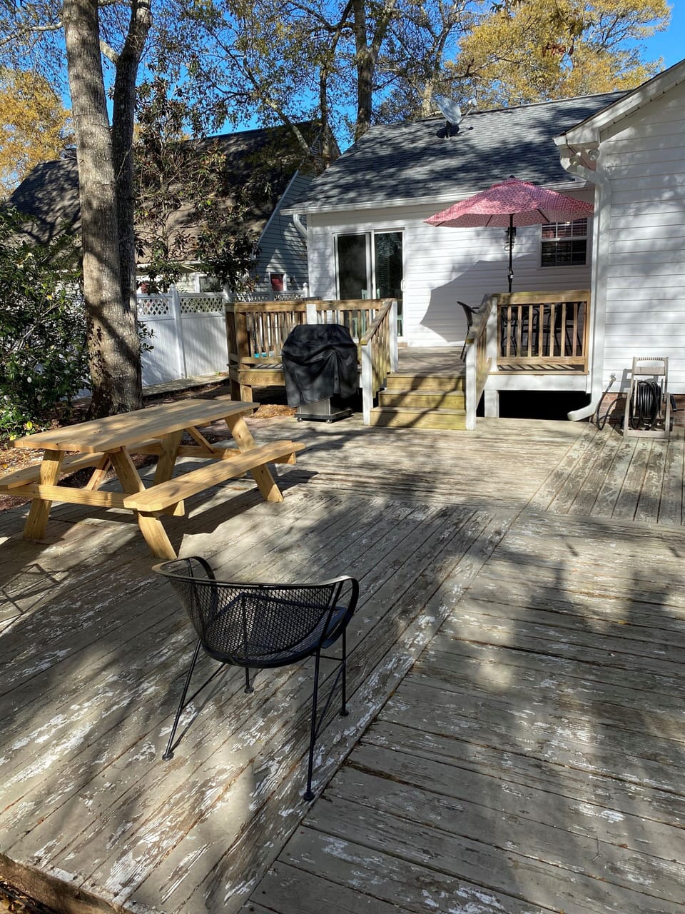 Large fenced in backyard, grill and fire pit