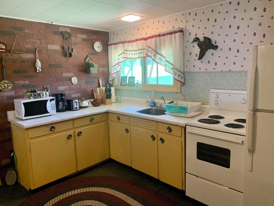 The Kitchen with everything needed and a bbq outside for grilling 