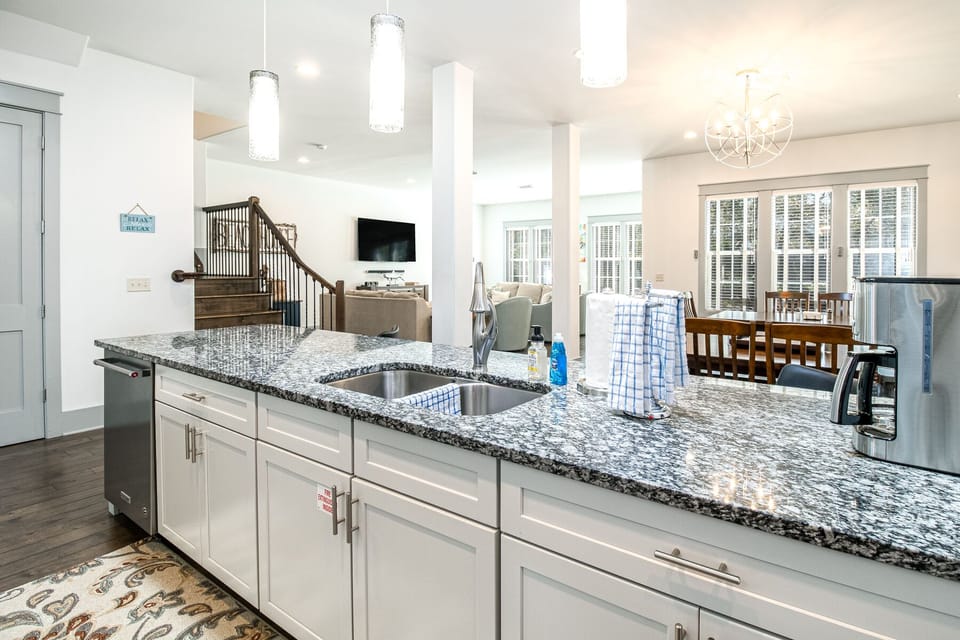 Large granite counter provides plenty of room for meal prep