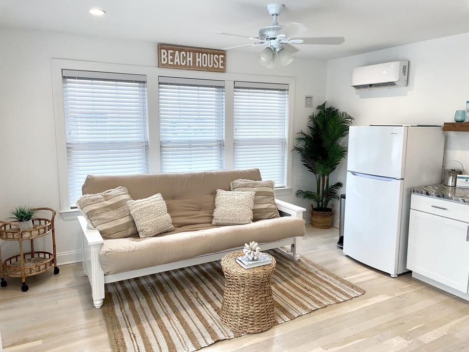 Rooftop den with queen futon, wet bar, refrigerator and full bath.   