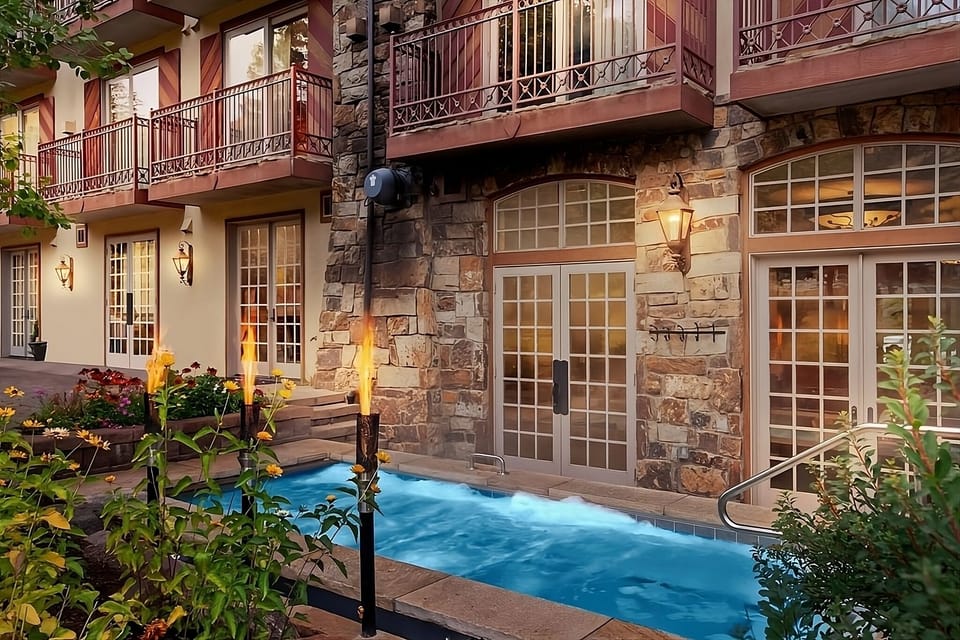Soak in steamy waters while flames flicker beside you