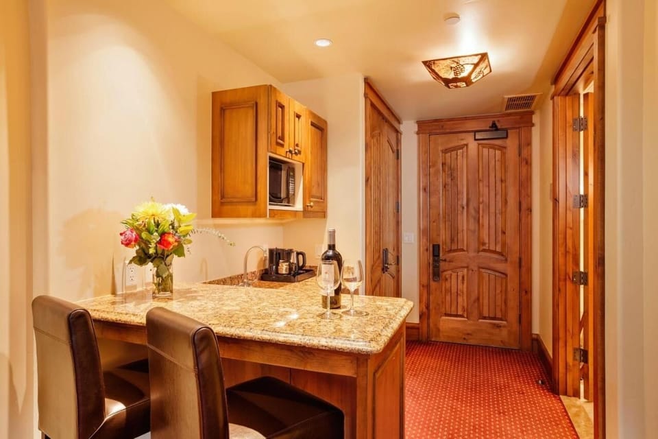 Pour drinks and prep snacks at the granite kitchenette bar.
