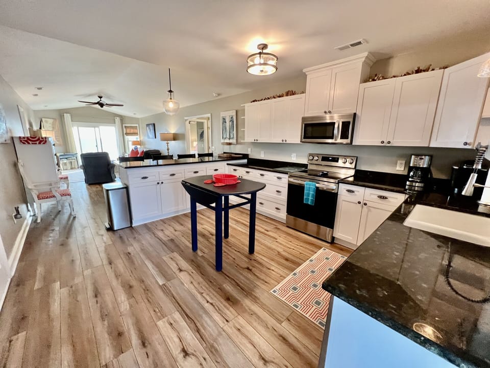 Upper Level fully stocked kitchen. One of two kitchens in the home