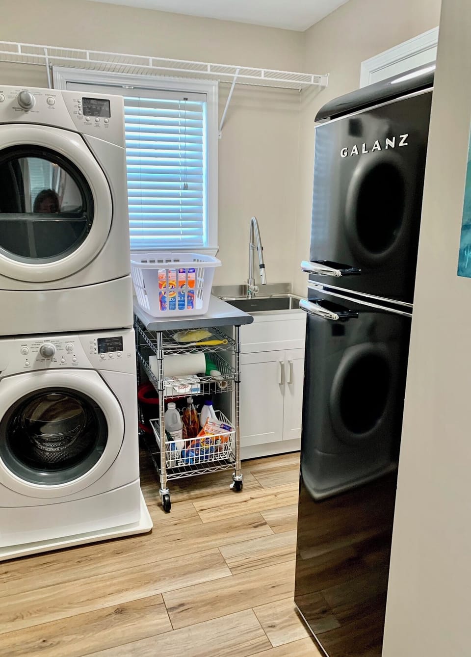 Second refrigerator in upper level laundry room. Laundry pods are provided.