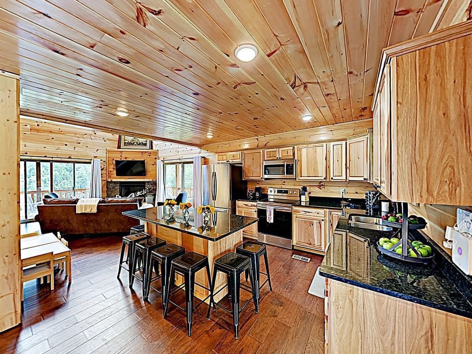 Spacious kitchen with eat-up island for 8 and all the essentials to cook a meal.