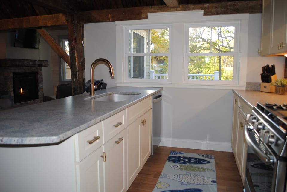Kitchen overlooks the deck for easy libation/food pass through!