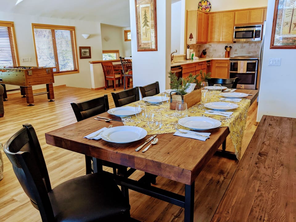 Dining area with large bench seating for extra guests.