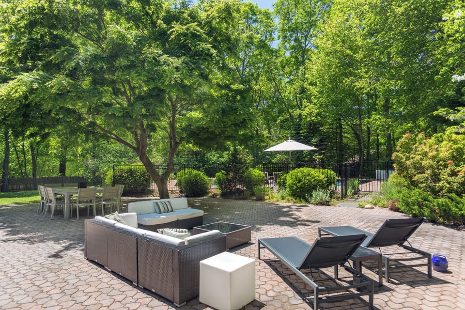 Very private outdoor couch/lounge area & dining separately fenced from pool area