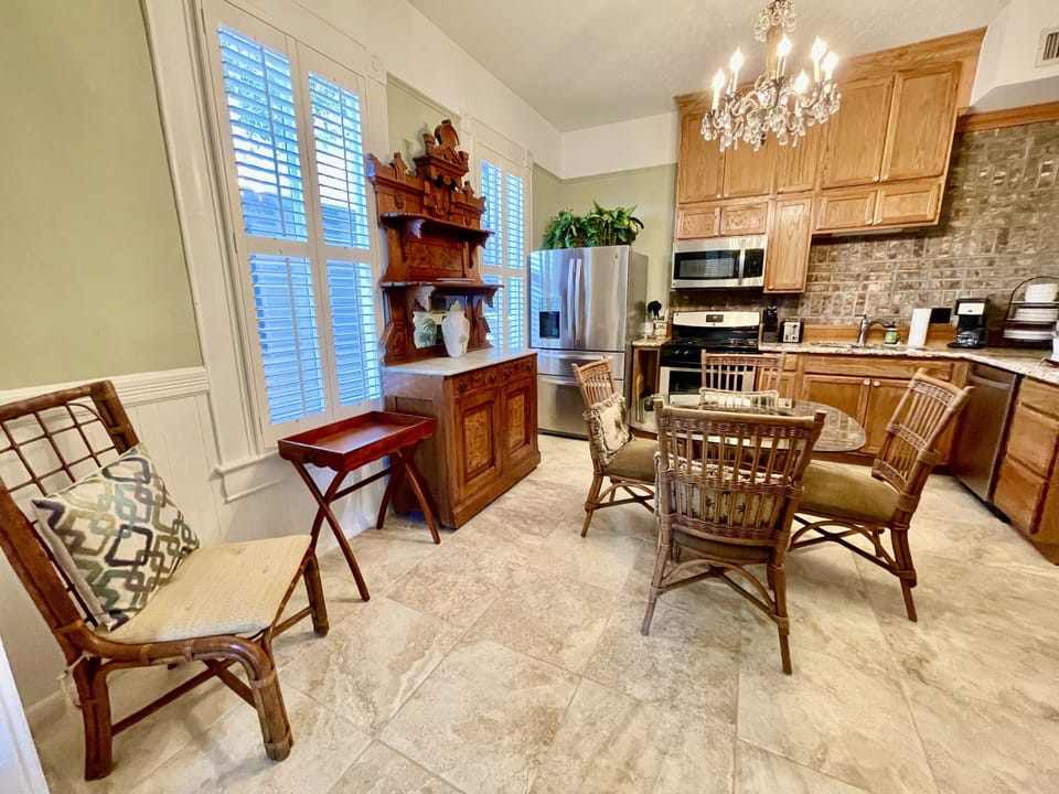 dining area with full kitchen and gas fireplace 