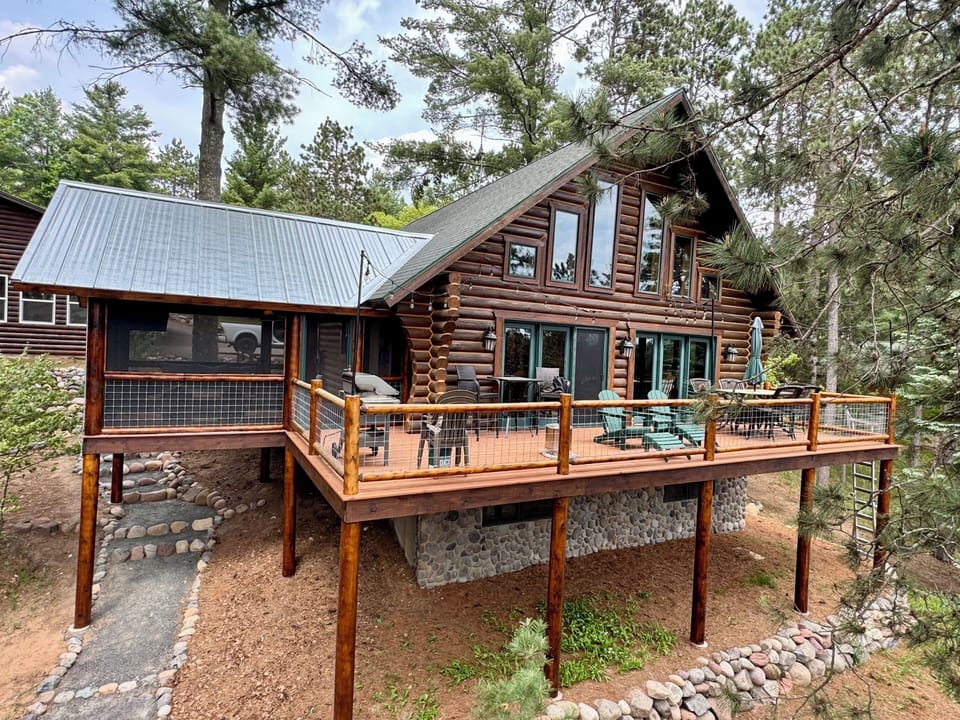 Log cabin with huge wraparound deck and screened porch (view from lake side)!