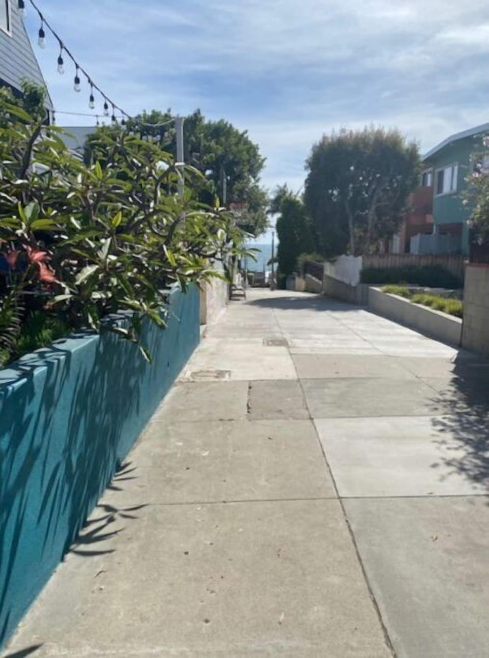Walk street, front of property, with a view of the ocean.