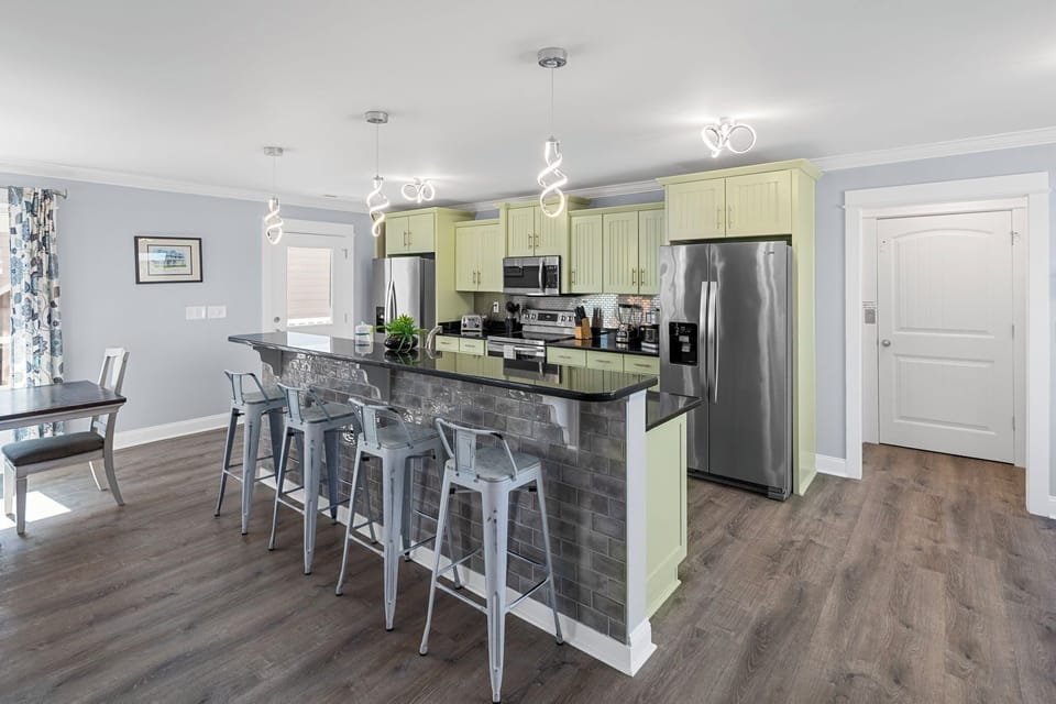 Cook up a feast in the fully equipped kitchen featuring stainless steel appliances. Dishwasher for easy clean up. 