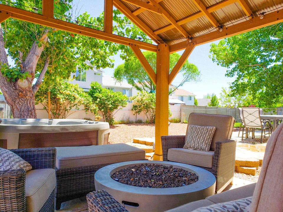 Massive fully fenced backyard with gazebo, dining & hot tub!
