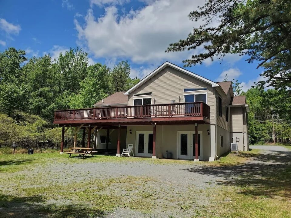 Rear view of the house - hot tub is on the deck with a view of the lake